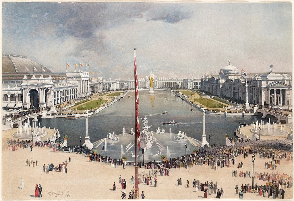 View of the Court of Honor and Statue of the Republic, World's Columbian Exposition, Chicago, 1893. The image shows the Columbian Fountain and the Great Basin (the pool) in the center, with the Manufactures and Liberal Arts Building on the left and the Agricultural Building on the right. In the distance is the great Statue of the Republic.